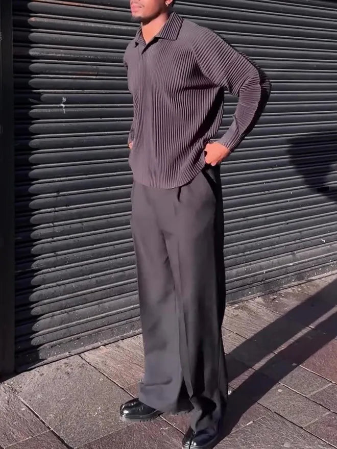 Black men's long-sleeved casual top with pleated detail on the front.