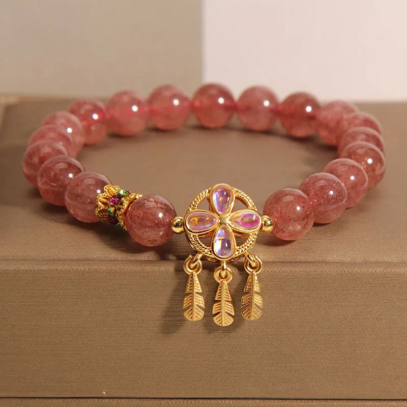 Strawberry quartz women's bracelet with four leaf clover dream catcher design and ball pendant charm