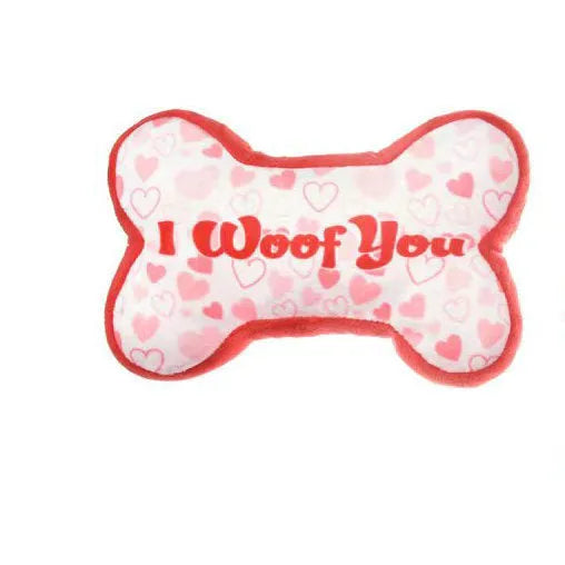 Pet plush tooth cleaning toy with textured surfaces for dental hygiene and vocalisation feature, shown in multiple colour options