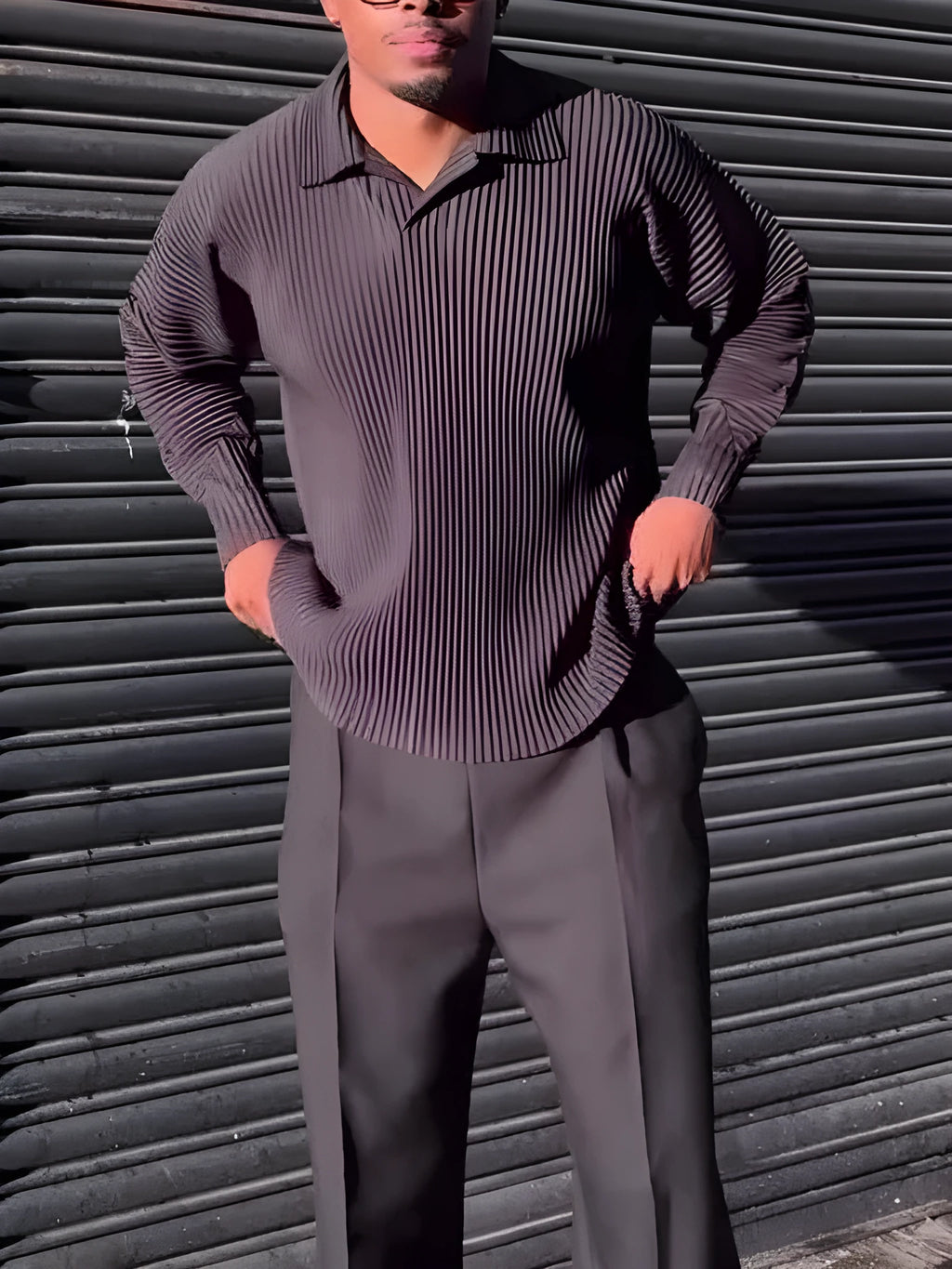 Black men's long-sleeved casual top with pleated detail on the front.
