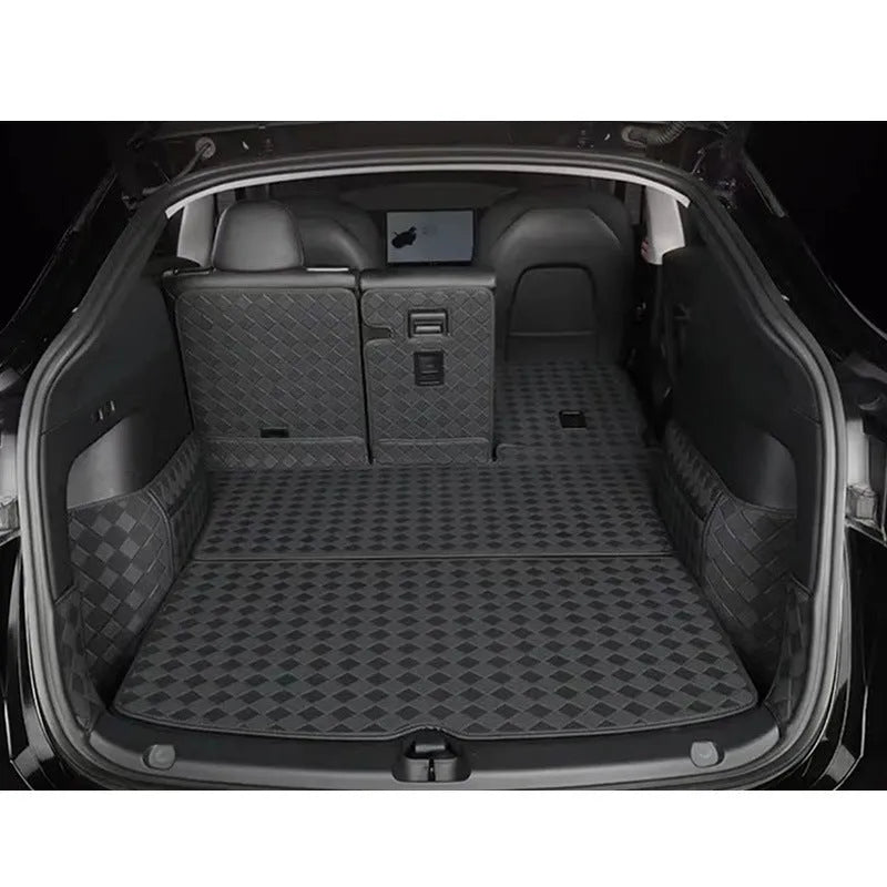 Leather trunk mat for Tesla Model 3 and Model Y in black, shown in car boot.