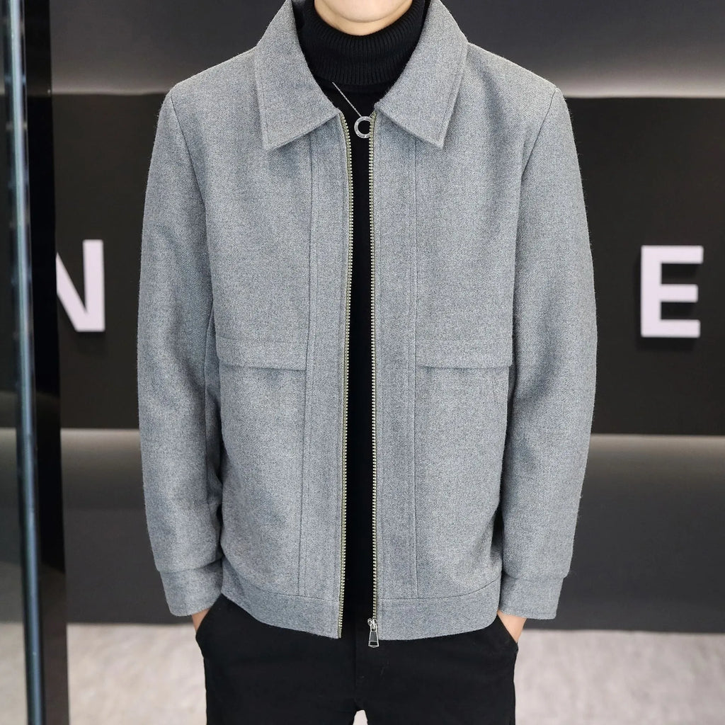 A man's khaki casual jacket with a polo collar and side seam pockets.