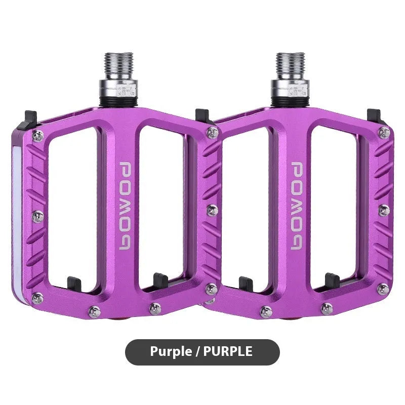 Pair of aluminium alloy bicycle pedals with integrated LED lights in multiple colour options