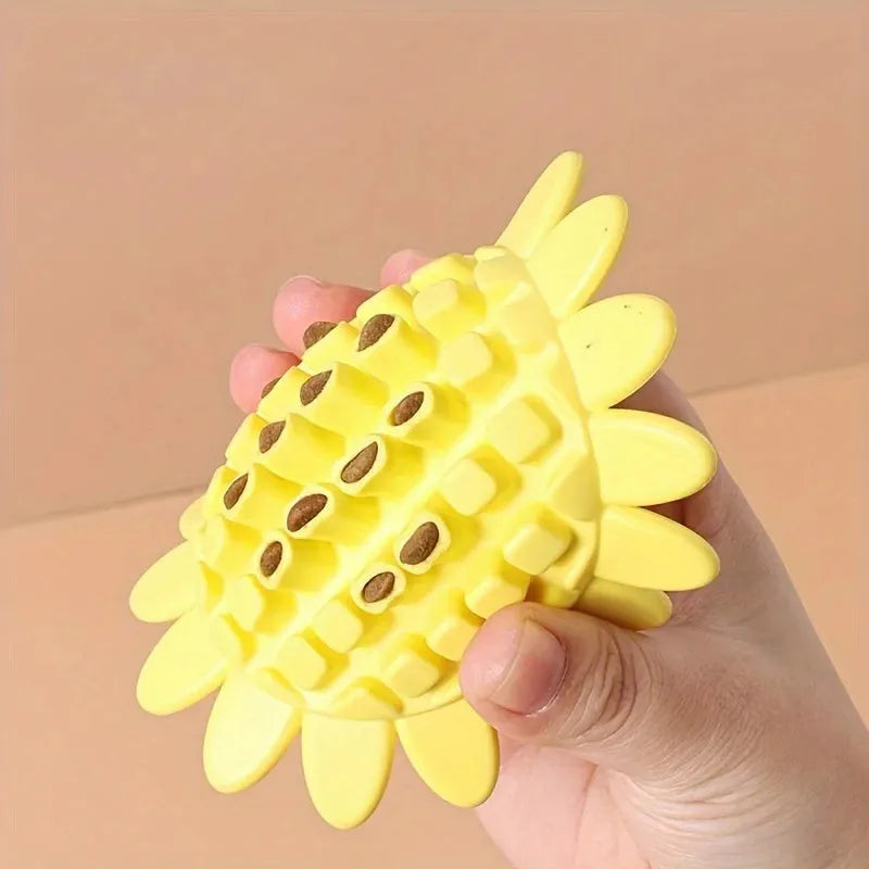 Yellow rubber sunflower-shaped dog chew toy with textured petals.