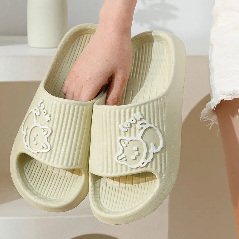 Green cat-themed thick platform sliders with a non-slip EVA sole on a white background.