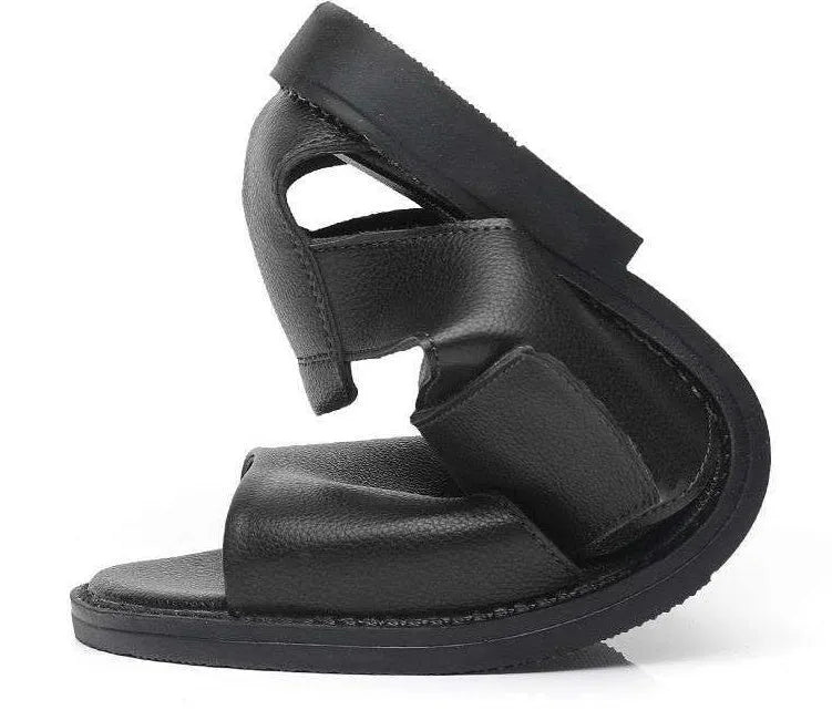 Men's black leather sandals with open-toe design and non-slip rubber soles on a beach background