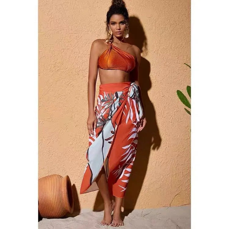Brown high waisted women's push up bikini swimsuit with chiffon skirt overlay and split design.