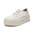 Women's black embossed cowhide leather platform sports shoes with white rubber sole and lace-up front.