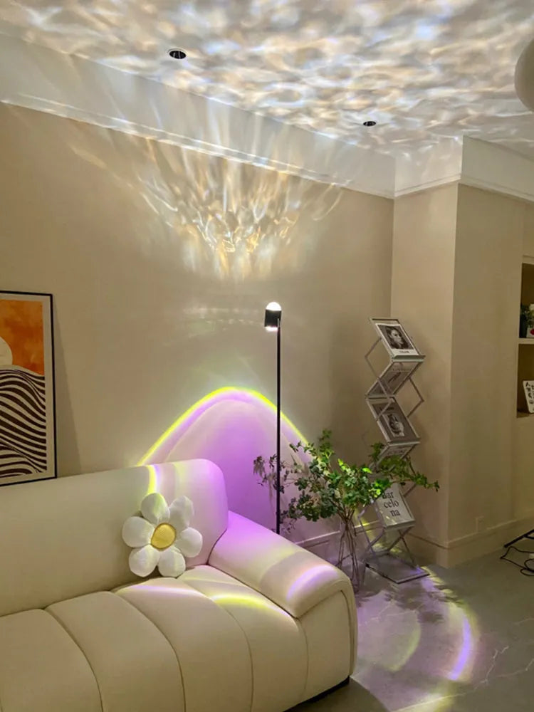 Sunset red floor lamp projecting a water wave light pattern on a living room floor.