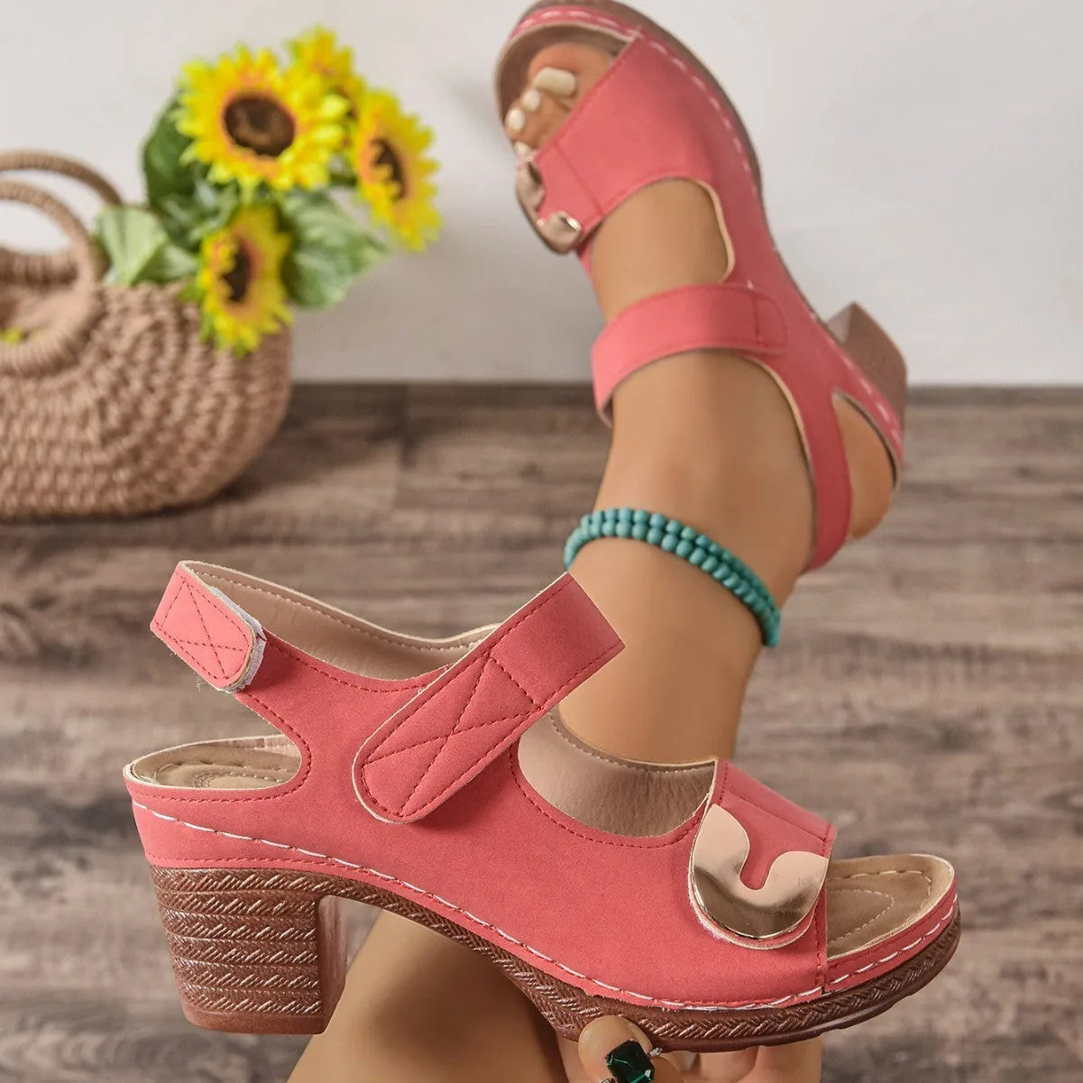 Light brown Roman sandals with Velcro strap and round toe on a rubber sole