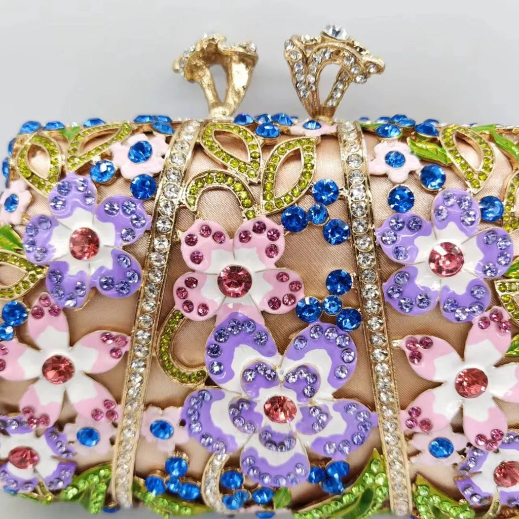 Gold oval metal evening clutch with enamel flower, hollow, diamond and dripping oil detail, 22cm long