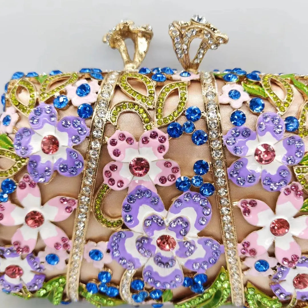 Gold oval metal evening clutch with enamel flower, hollow, diamond and dripping oil detail, 22cm long