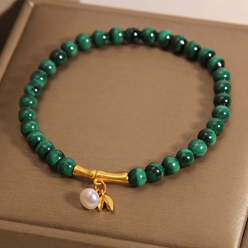 White crystal lucky bamboo bracelet for women with a high-rise design on a wrist.