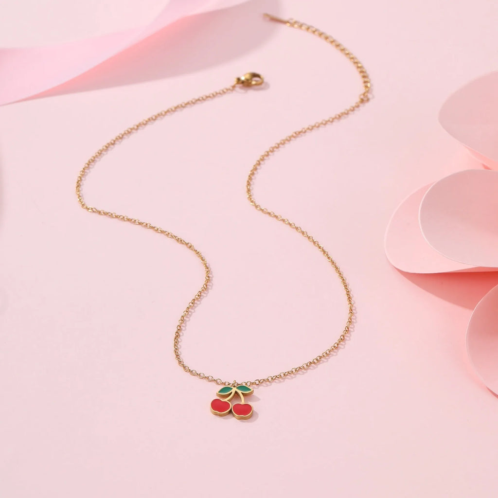 Complete cherry jewellery set with stainless steel necklace, bracelet, earrings, and ring on 18K electroplated chain.