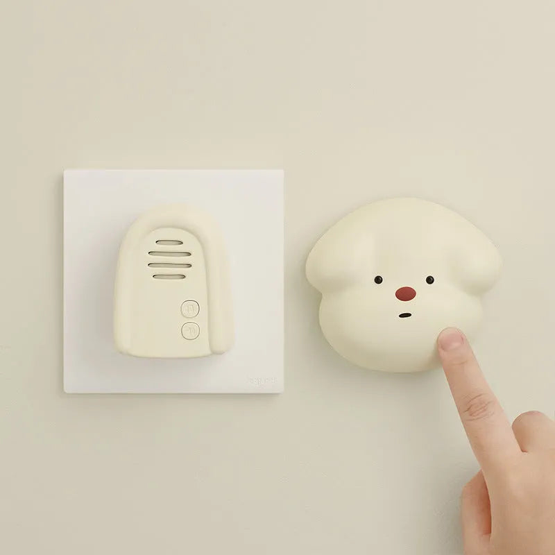Wireless plug-in doorbell in milky yellow colour with compact design for household use