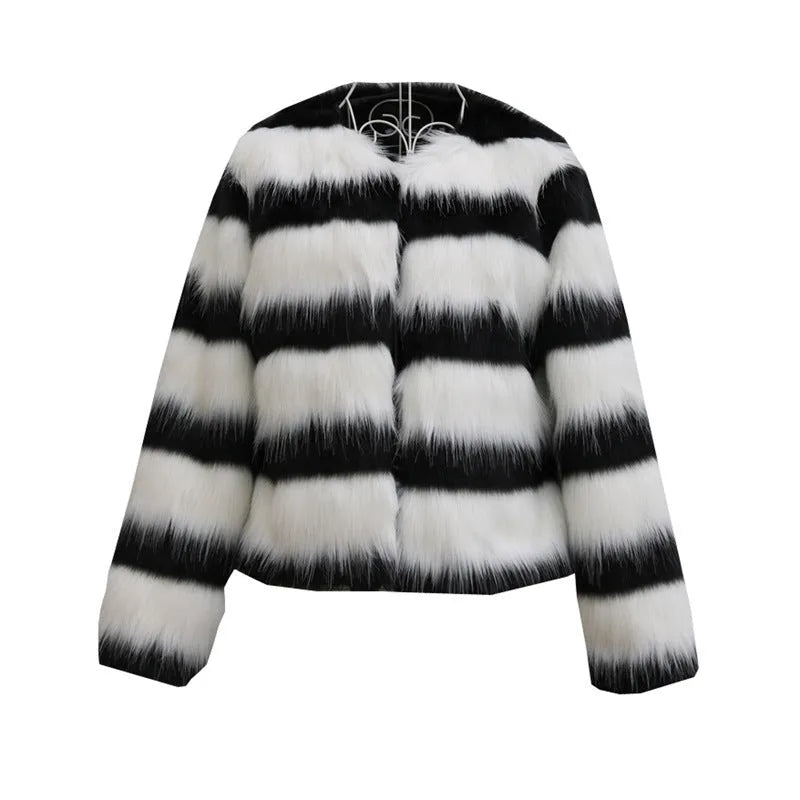 Black and white striped faux fur jacket with long sleeves on female model