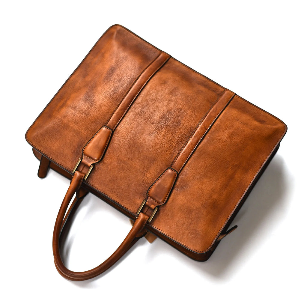 Men's 14-inch horizontal leather handbag with zipper opening in khaki colour, showing vegetable-tanned cowhide texture