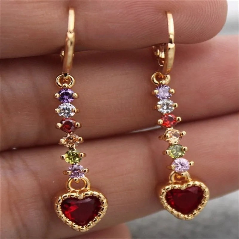 Gold and silver heart-shaped earrings with electroplated finish, showing front and back views