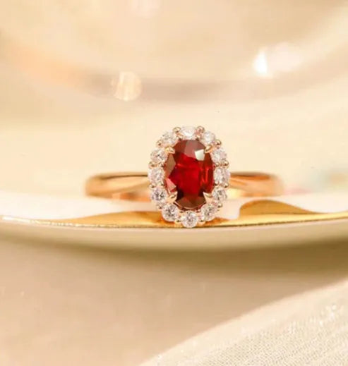 Women's sterling silver ring with gold pigeon blood ruby gemstone and floral pattern design