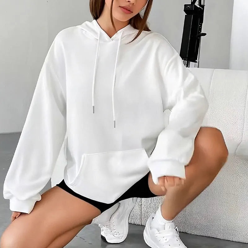 Women's loose grey sweatshirt with long sleeves and a front drawstring pocket, shown in a relaxed fit.