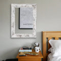 Wall-mounted dressing mirror with retro Chinese style white frame in bathroom setting