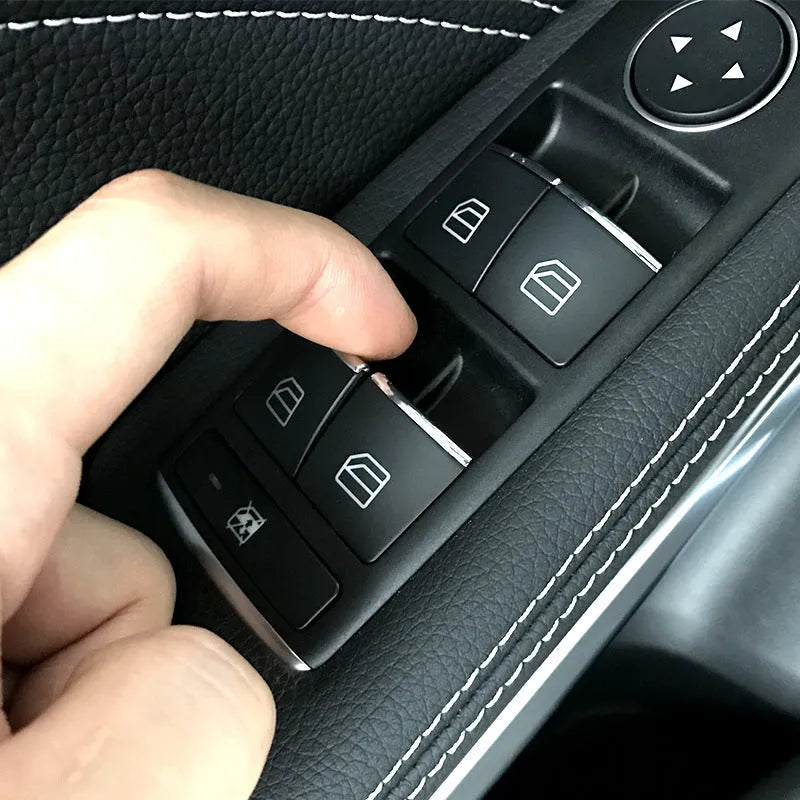 Black glitter window lift button modification sticker measuring 6cm by 3cm with adhesive backing