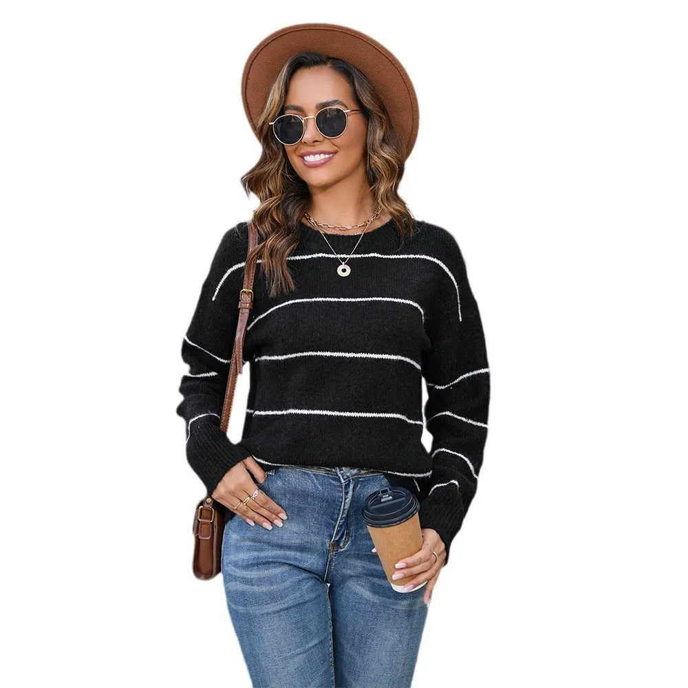 Black and white striped women's pullover sweater with loose fit and round neckline