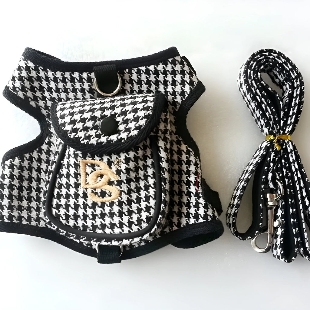 Black houndstooth cotton vest for a small dog, showing the leash attachment strap on the back.