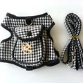 Black houndstooth cotton vest for a small dog, showing the leash attachment strap on the back.