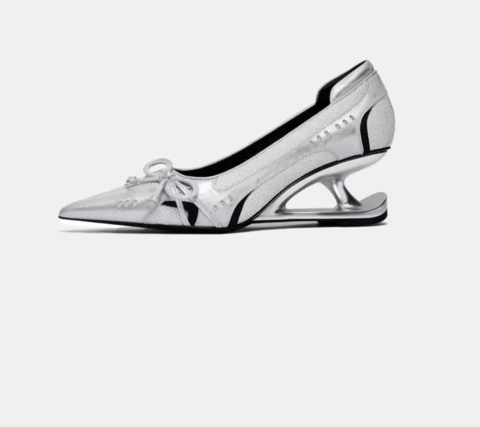 Women's black pointed toe Mary Jane shoes with a unique floating shaped heel