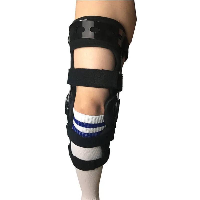 Black anterior ligament knee pad with adjustable straps, showing brushed cloth interior and sandwich fabric construction