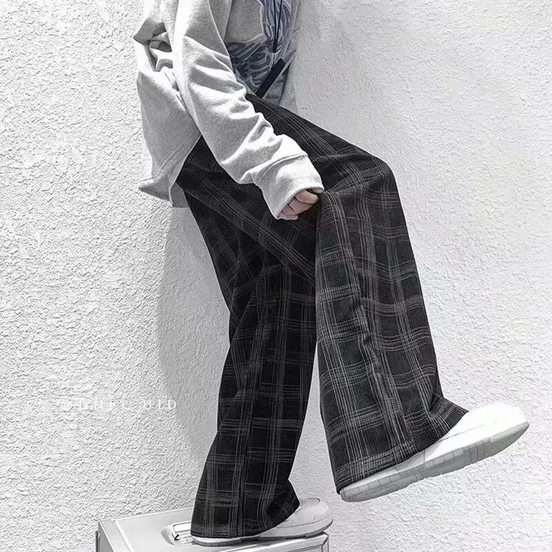 Men's black and green plaid trousers with straight leg design and mid-rise waistband