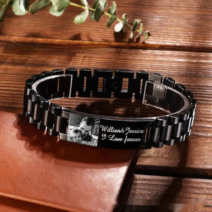 Titanium steel heart-shaped bracelet with black lettering on a curved band.