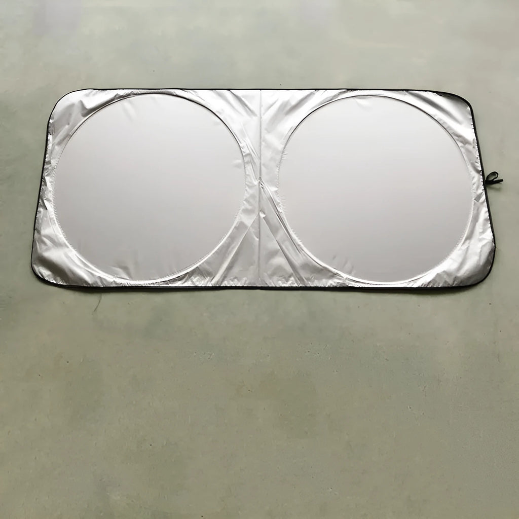 Silver reflective car sunshade measuring 190cm by 90cm folded in its cloth storage bag
