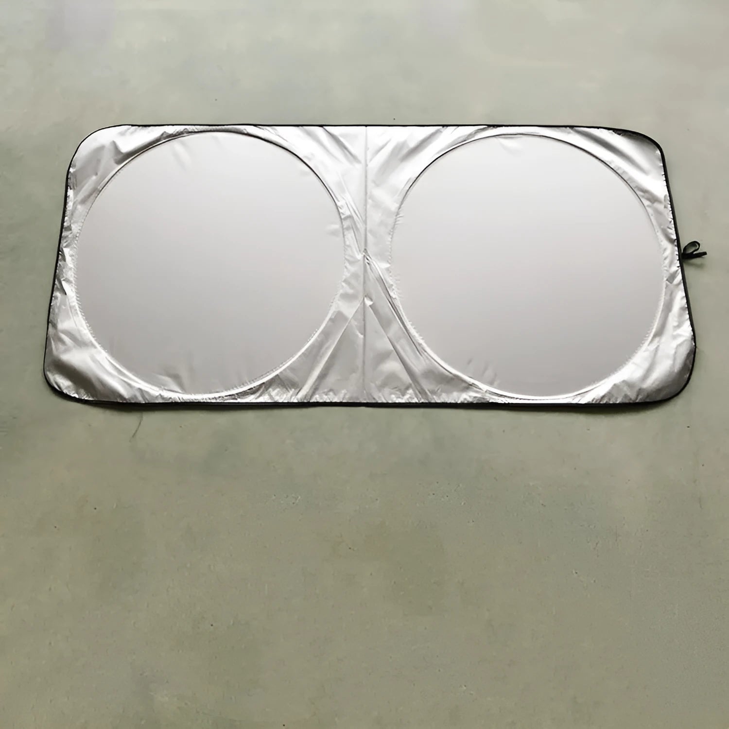 Silver reflective car sunshade measuring 190cm by 90cm folded in its cloth storage bag