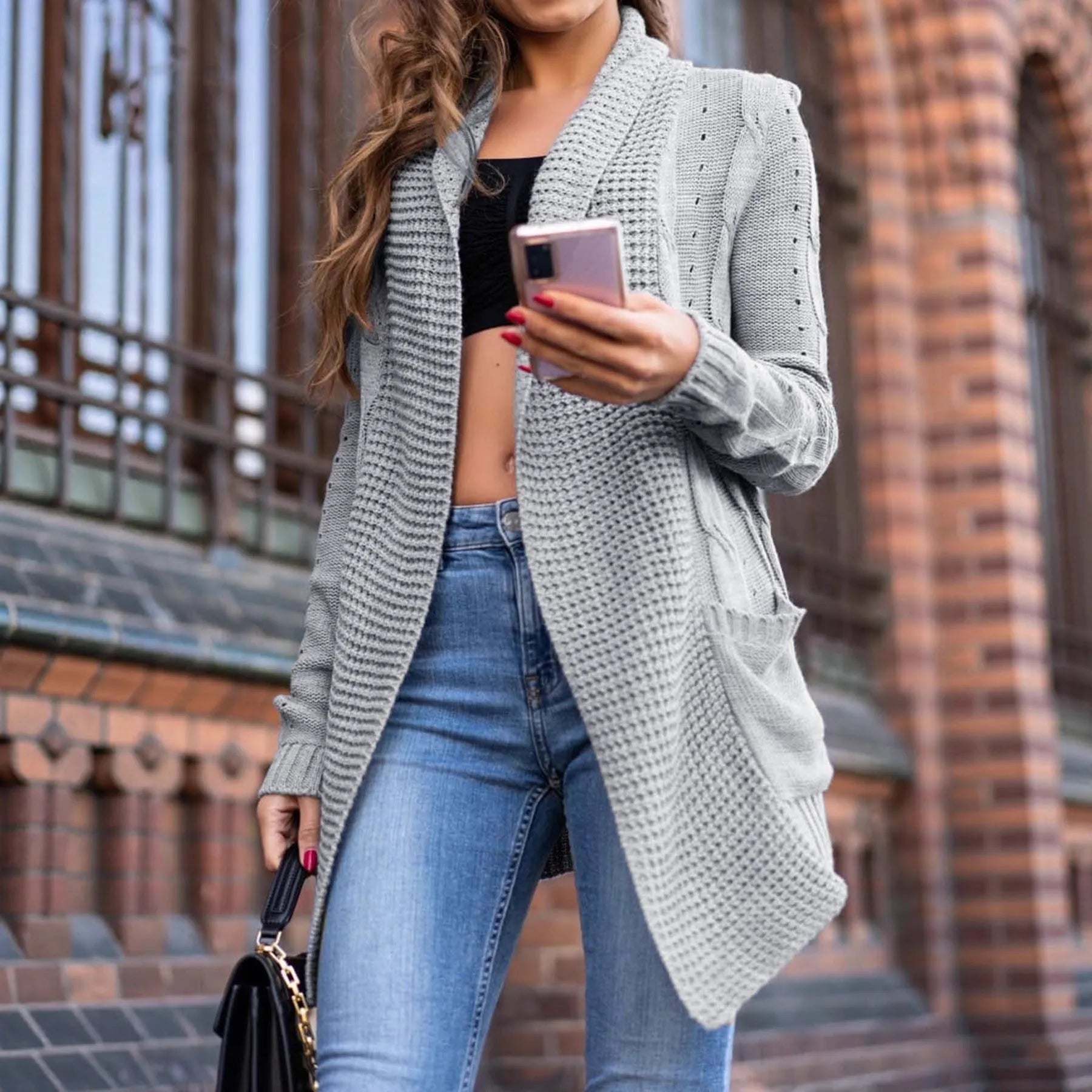 Grey women's loose long sleeve cardigan coat with patch pockets.
