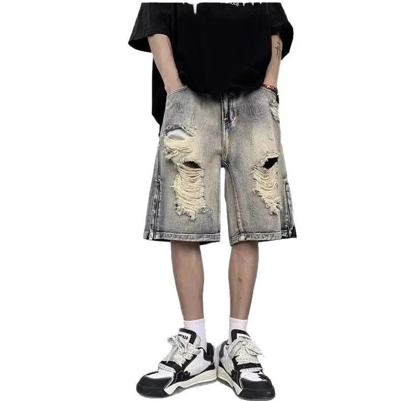 Blue retro tattered denim shorts with a wide leg loose fit on a neutral background.