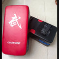 Red martial arts kick target for boxing and combat training with hand-sewn construction
