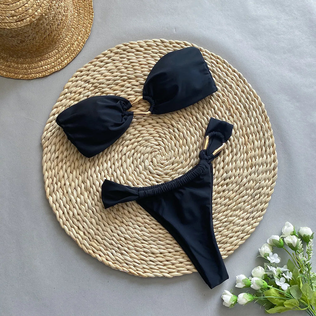 Black low-waist women's bikini swimsuit with split sides and briefs design