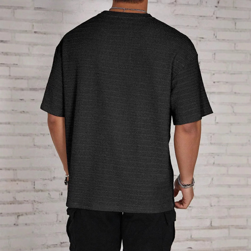 Men's slim-fit T-shirt in solid colour with loose hollow design, made from polyester fabric