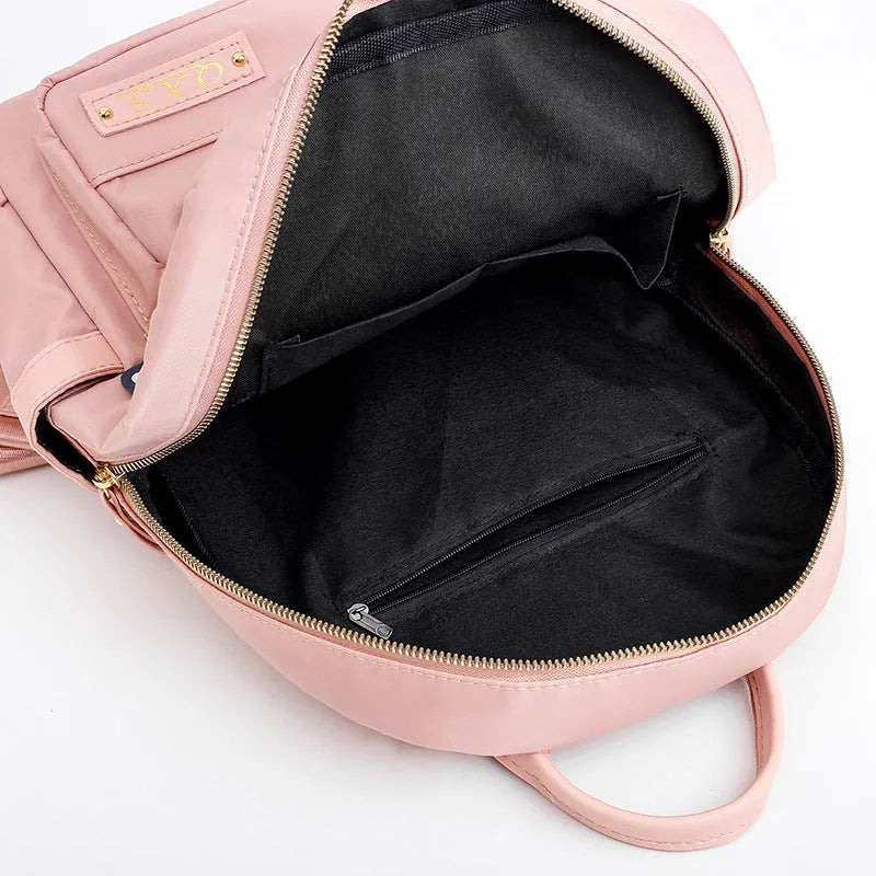 Black casual backpack with double straps and multiple compartments, 20L capacity