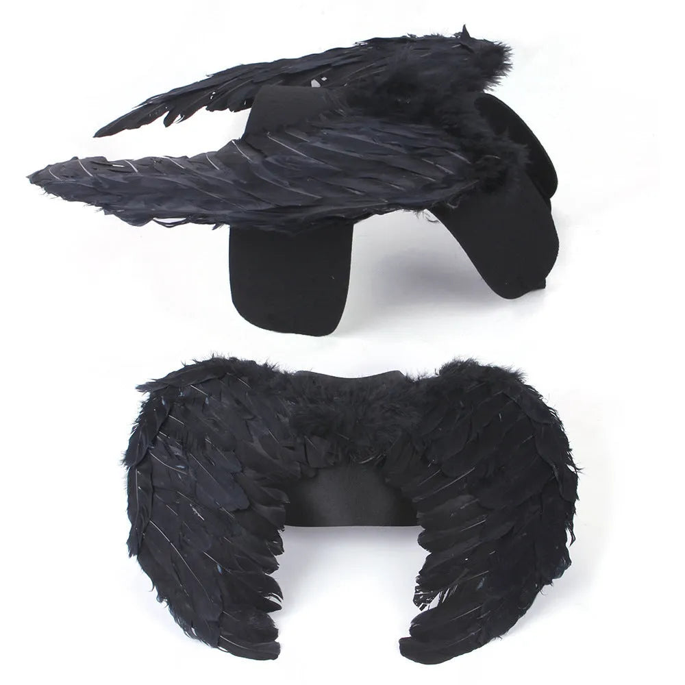 Black and white angel wings costume for dogs on chest and back, with adjustable straps.