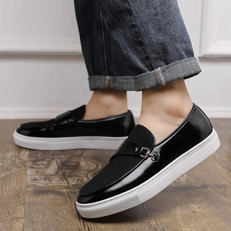Men's black slip-on loafer with a gold horsebit buckle, round toe, and visible stitching.