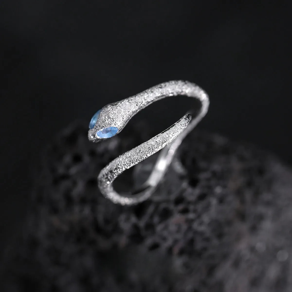 Adjustable silver snake ring with electroplated platinum colour finish and detailed scale texture
