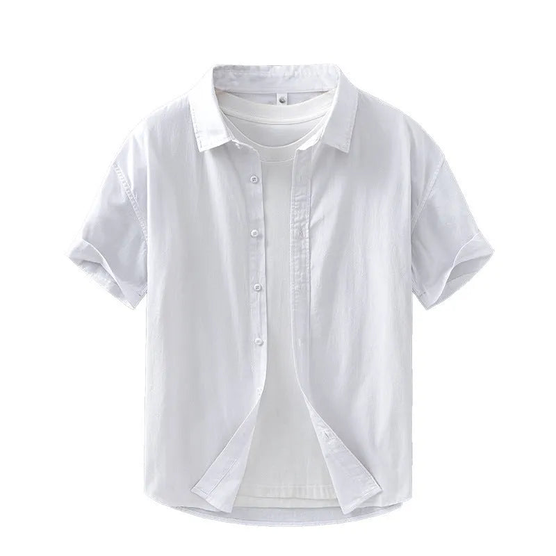 Man wearing a light grey loose-fit short-sleeved cotton cardigan-style shirt