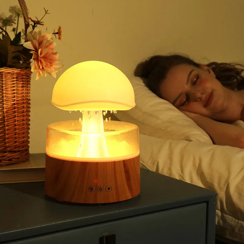 White rain cloud shaped humidifier with rainfall simulation and colour changing night light functions
