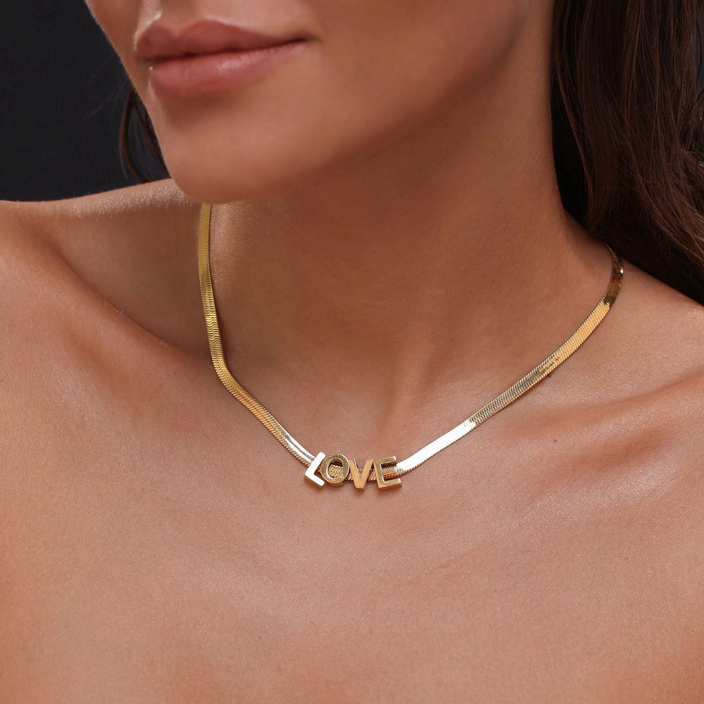 Titanium steel necklace with 40.5cm chain and electroplated gold charms showing numbers and letters for personalisation