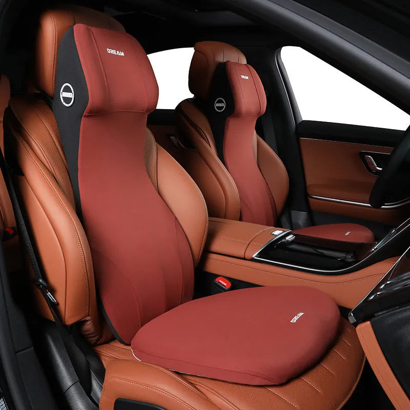 Black automotive memory foam cushion mat with integrated headrest and lumbar support pillow on a car seat.