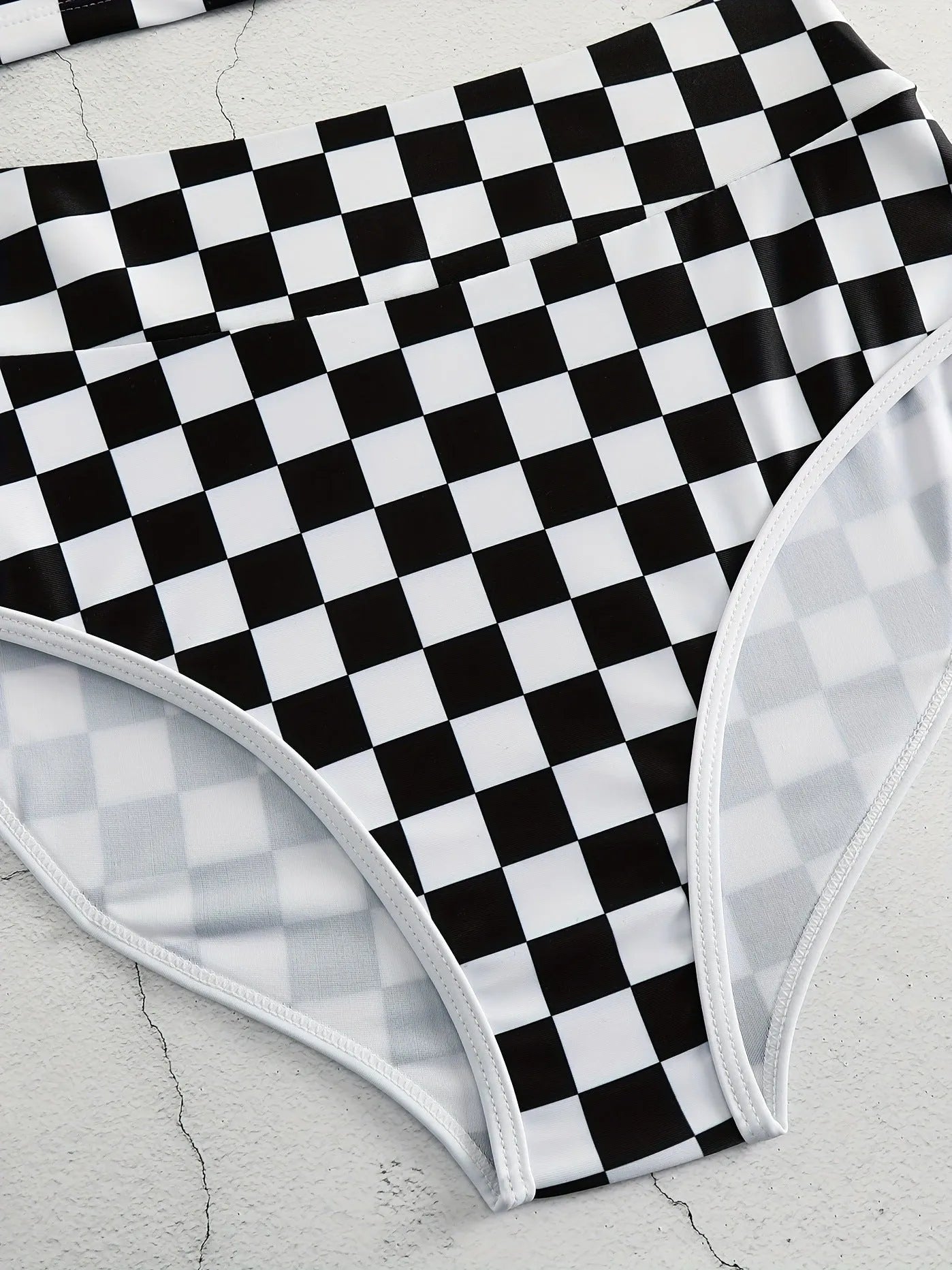 Women's check pattern racing swimsuit with backless suspender design in polyester fabric