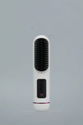 White portable negative ion hair comb with USB charging port and ABS plastic construction measuring 15-20cm length